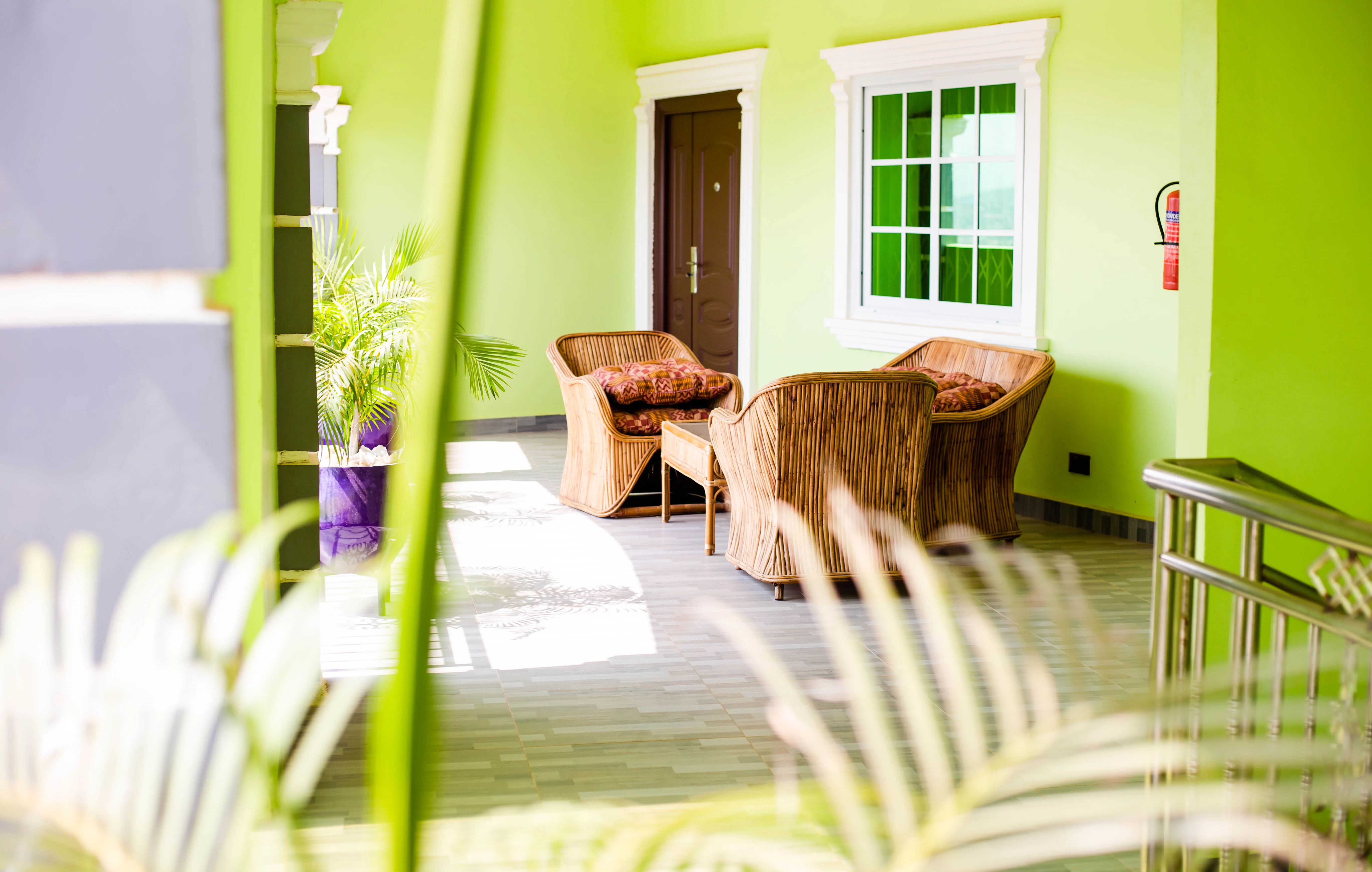 Bright covered terrace seating area at the property